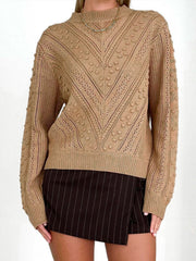 Camel textured chevron knit pullover sweater with bobble details and mock neck.