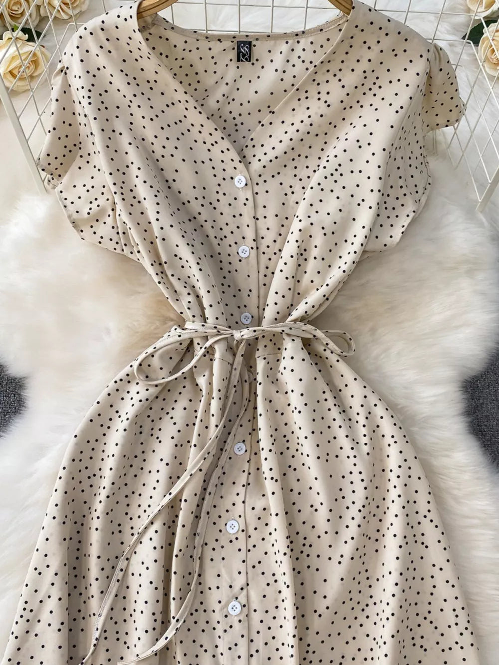 Apricot polka dot maxi dress with button front and tie belt.