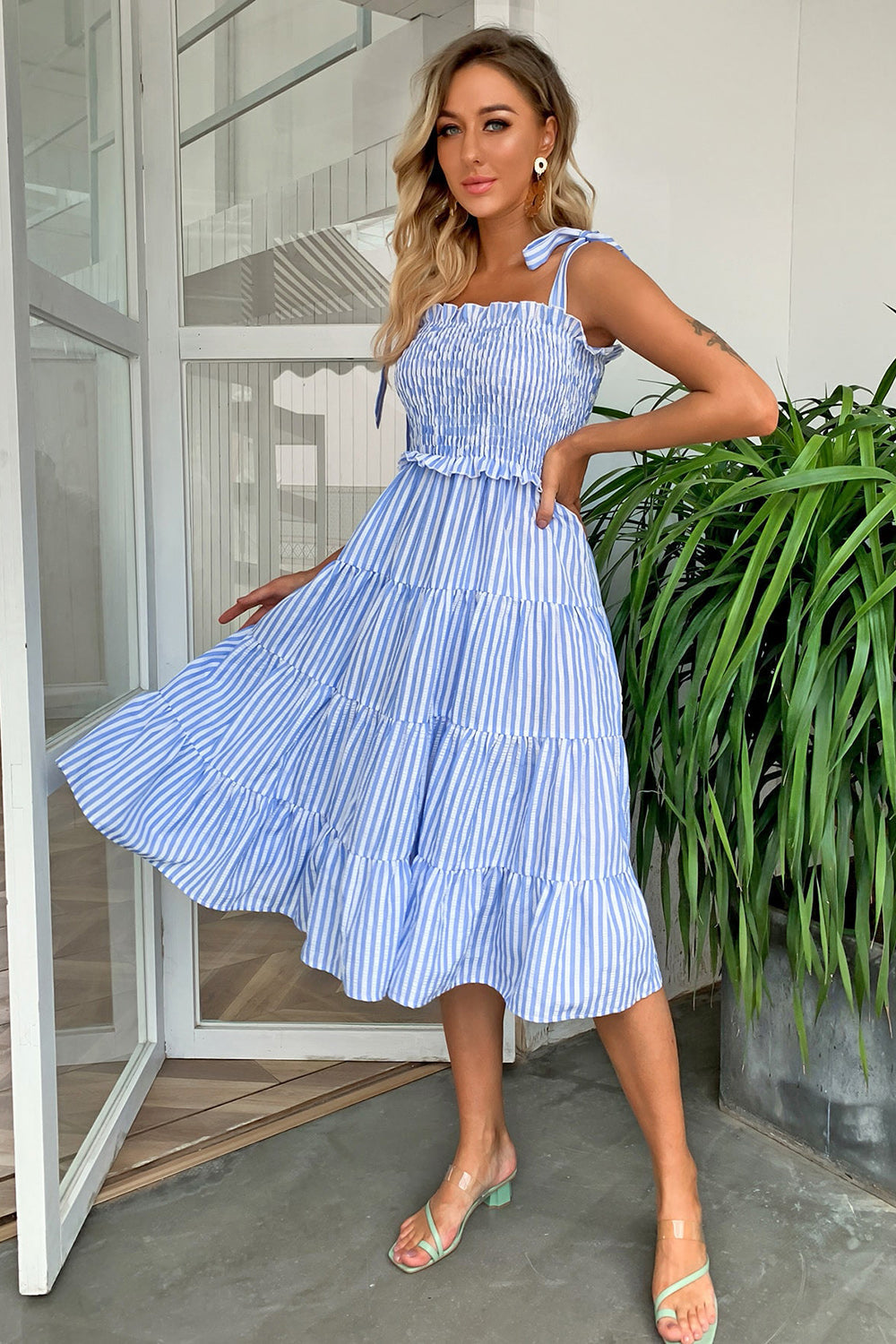 Pastel blue striped smocked bodice tiered midi dress with tie straps