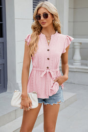 Blush pink eyelet peplum blouse with tie waist, flutter sleeves and button front.