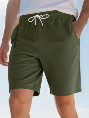 Men's military green chino shorts with drawstring waist and zip pocket.