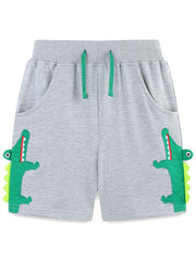 Grey cotton shorts with green alligator applique and drawstring.