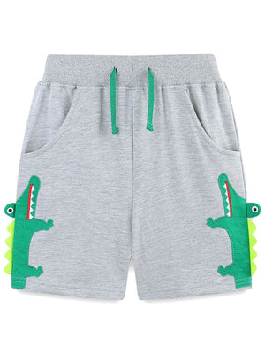 Grey cotton shorts with green alligator applique and drawstring.