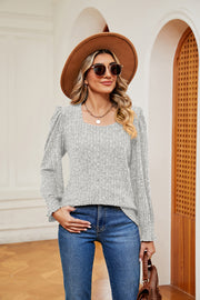 Light gray textured knit blouse with square neckline and cuffed sleeves