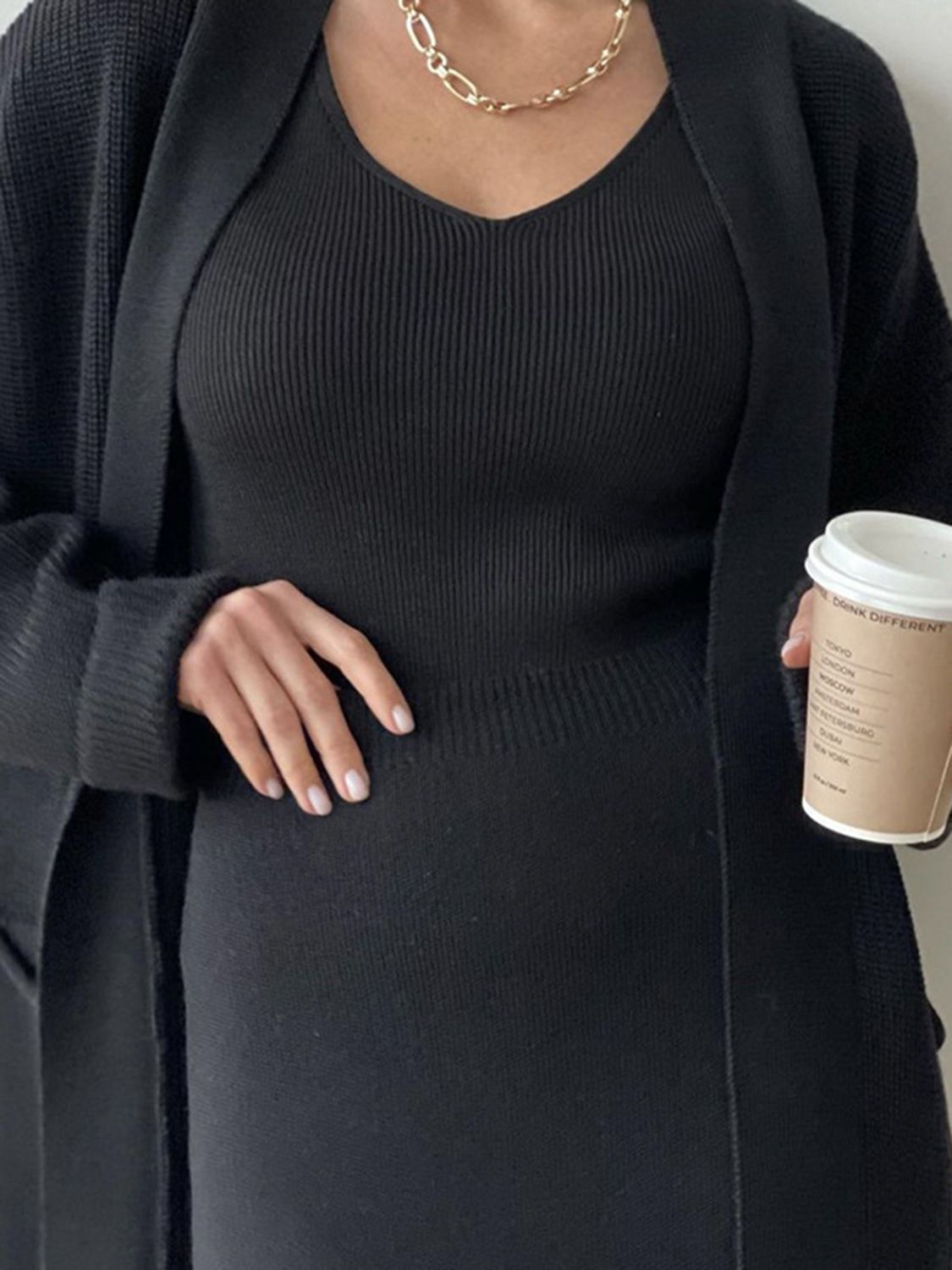 Black ribbed knit cardigan and v-neck tank top set with a modern silhouette.