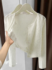 White lace button-up cardigan with delicate eyelet details and a cropped length.