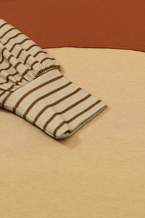 Maternity shirt with bishop sleeves in mustard and gray colorblock, featuring a striped sleeve cuff.