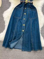 Light blue denim dress with belt, button front, chest pockets, and slit skirt.