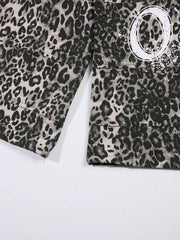 Leopard print cotton sweatpants with wide legs and a graphic detail.