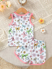 Toddler white floral & bowknot tank top and shorts set with pink trim.