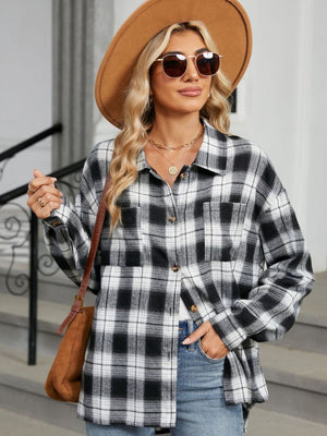 Black and white plaid collared long sleeve shirt with buttoned pockets