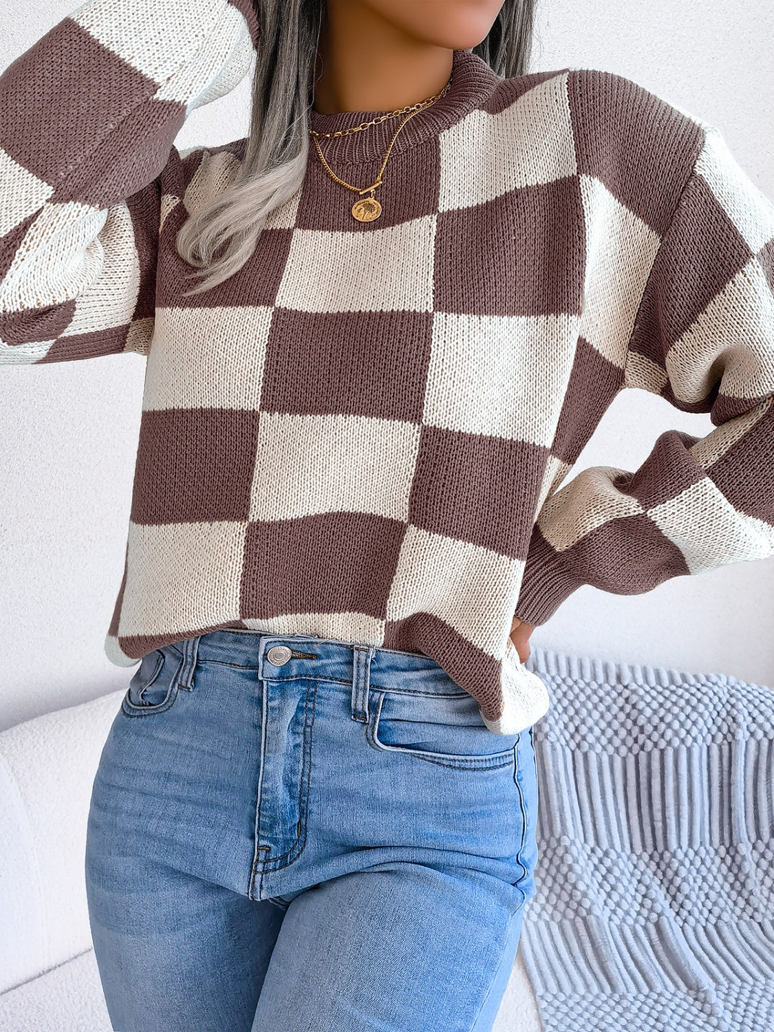 Checkerboard knit mock neck pullover sweater in brown and cream acrylic.