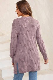 Lilac cable knit long cardigan with open front and side slits.