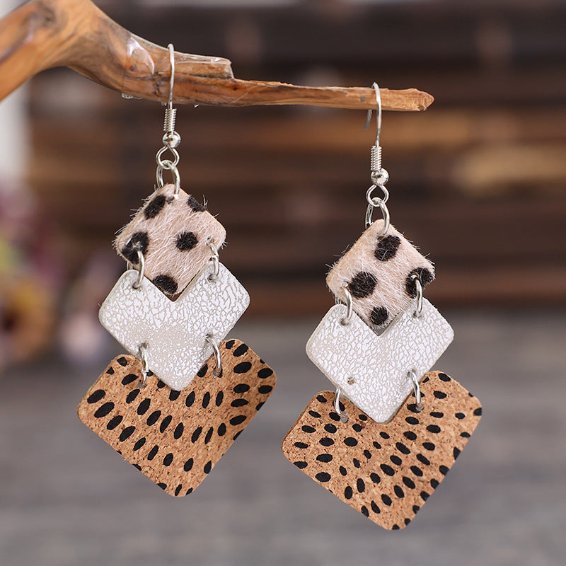 Textured leopard print drop earrings with tan and dark brown squares and a white textured square.