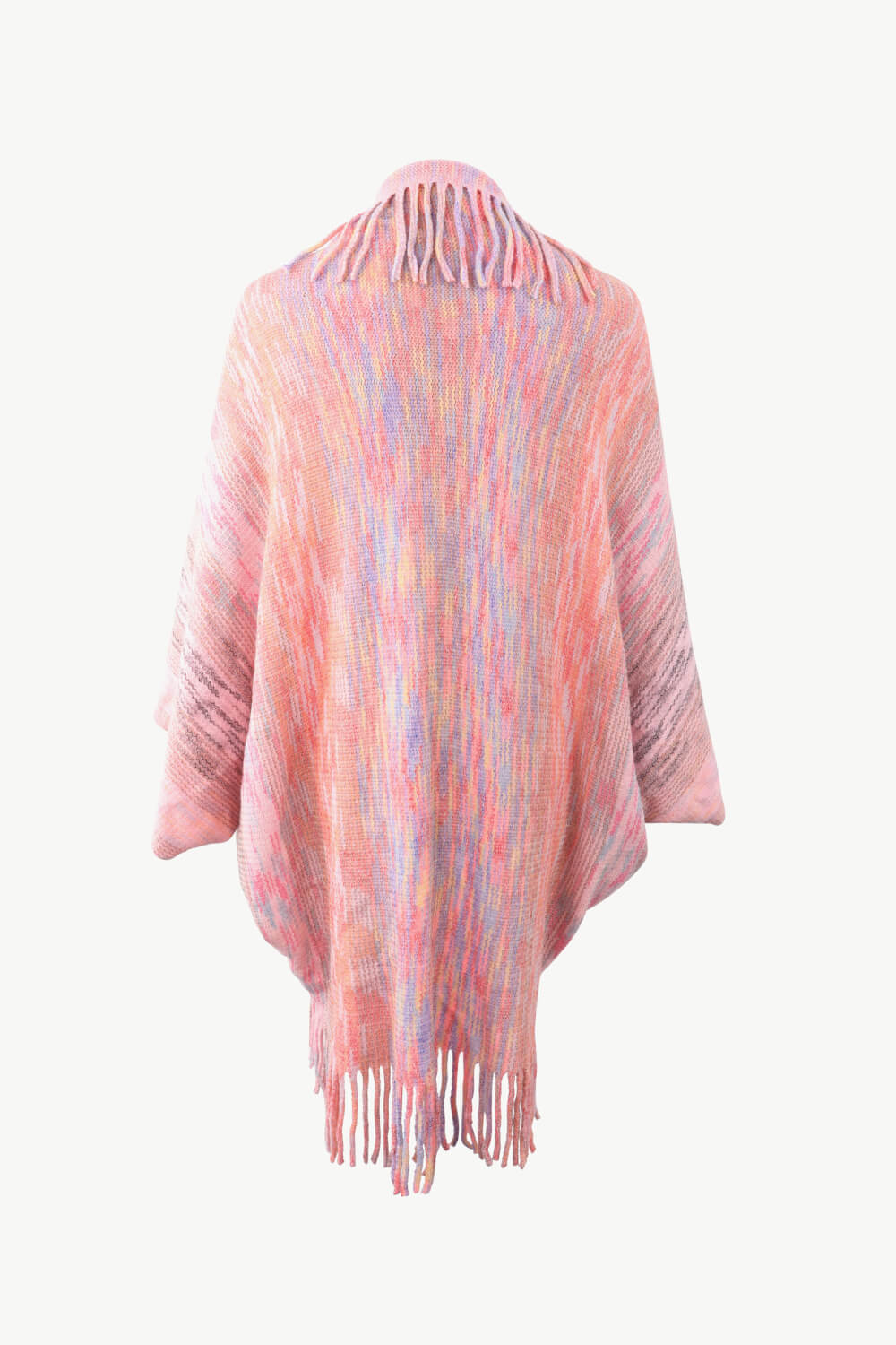Textured stripe fringe cape in blush pink with multicolor yarn and fringe detail.