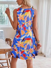 A-line dress in blue with a vibrant tropical floral print, sleeveless with a round neckline.