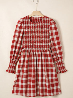 Red plaid cotton mini dress with smocked bodice, puff sleeves, and ruffled cuffs.
