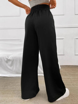 Black wide-leg sweatpants with a drawstring waist and elastic waistband.