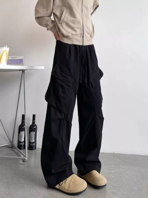 Black relaxed fit cargo pants with drawstring and multi pockets.