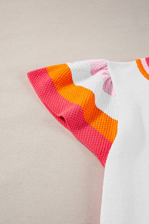 Flutter sleeve knit blouse with colorblock trim in pink, orange, and white.