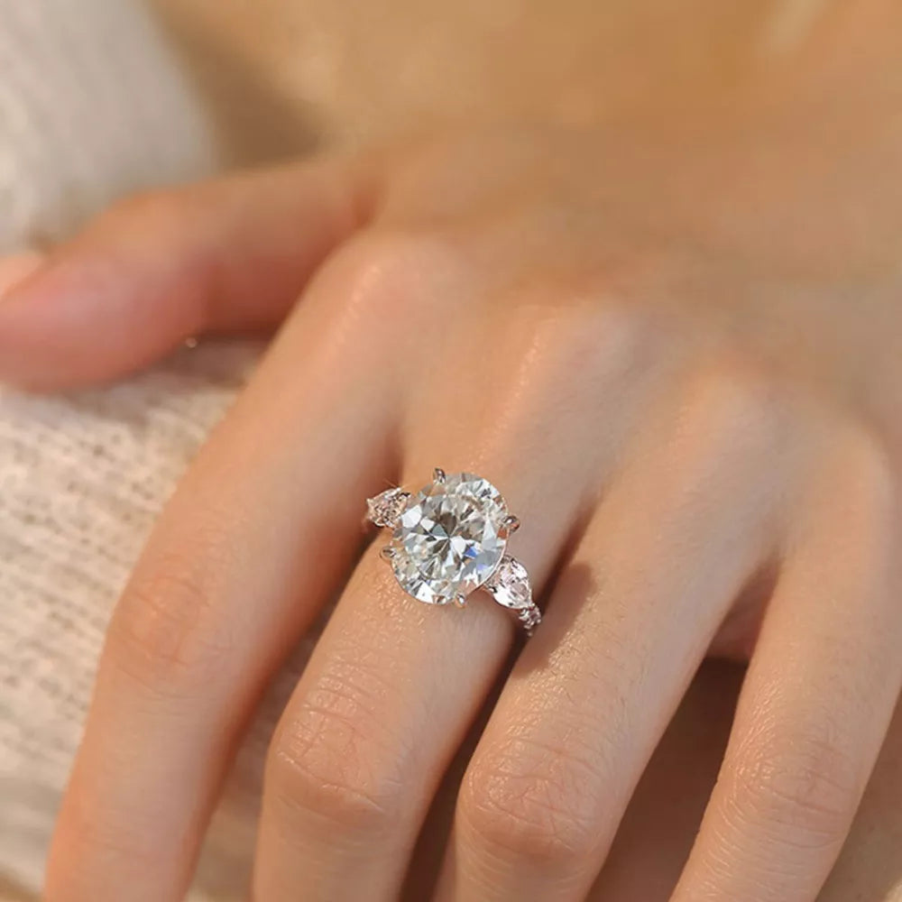 Dazzling Moissanite Oval Ring in Sterling Silver with side marquise stones.