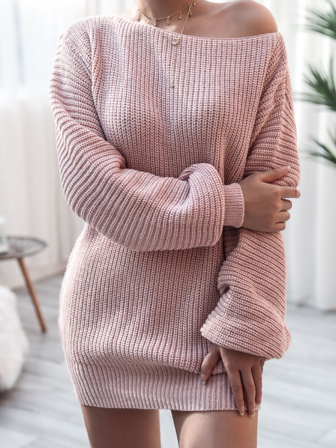 Light Mauve acrylic sweater dress with off-the-shoulder neckline and balloon sleeves.