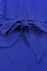 Royal blue tie-waist jumpsuit with a bow detail at the waist.