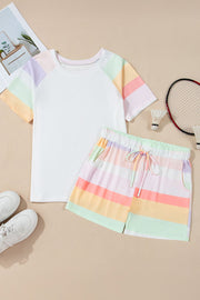 White loungewear set with pastel rainbow stripes on sleeves and shorts.