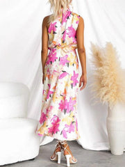 Vibrant floral midi dress with high neck and cinched waist, back view.
