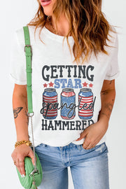 White graphic t-shirt with "Getting Star Spangled Hammered" text and American flag beer cans.