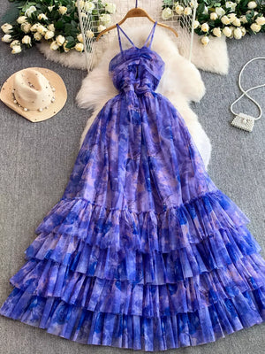 Romantic floral mesh maxi dress in Electric Purple with tiered ruffles and a ruched bodice.