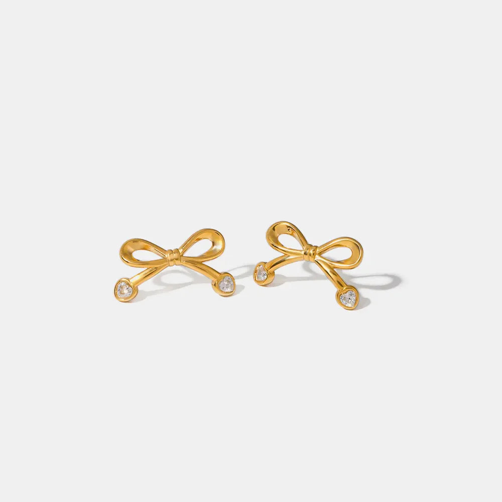 Gold cubic zirconia bow stud earrings with clear stones