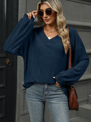 Textured ribbed v-neck blouson sleeve top in dark navy.