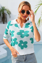 Floral knit polo shirt with contrast collar in turquoise and white, featuring a v-neck and short sleeves.