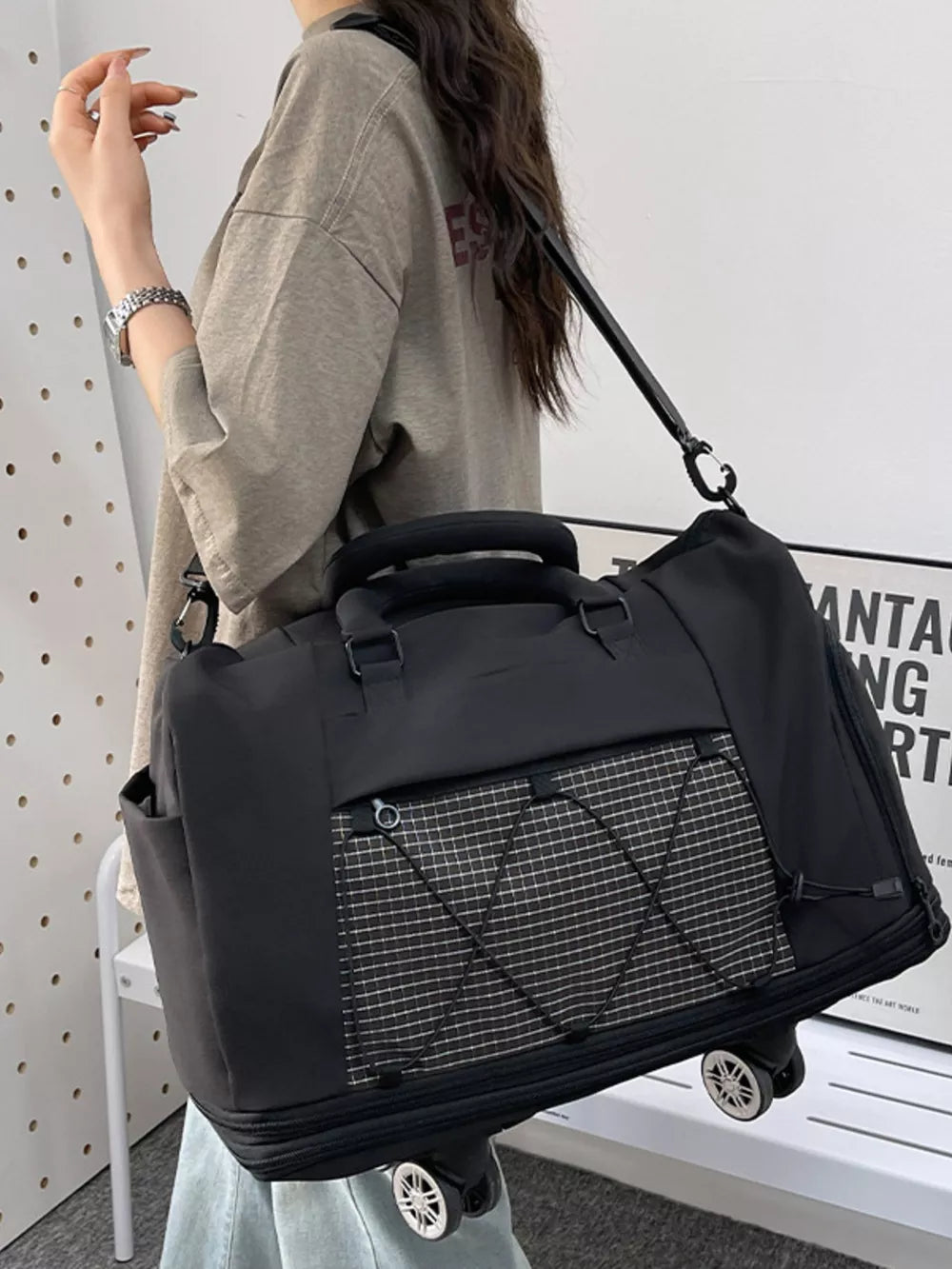 Black large Oxford rolling bag with checkered front pocket and wheels