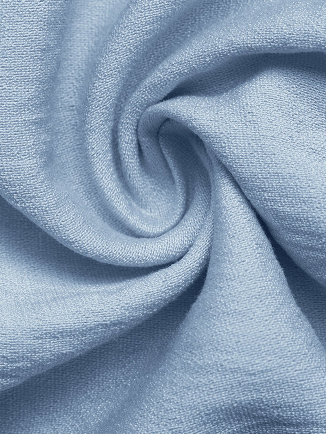 Blue maternity wrap romper fabric detail with soft texture and draped folds.