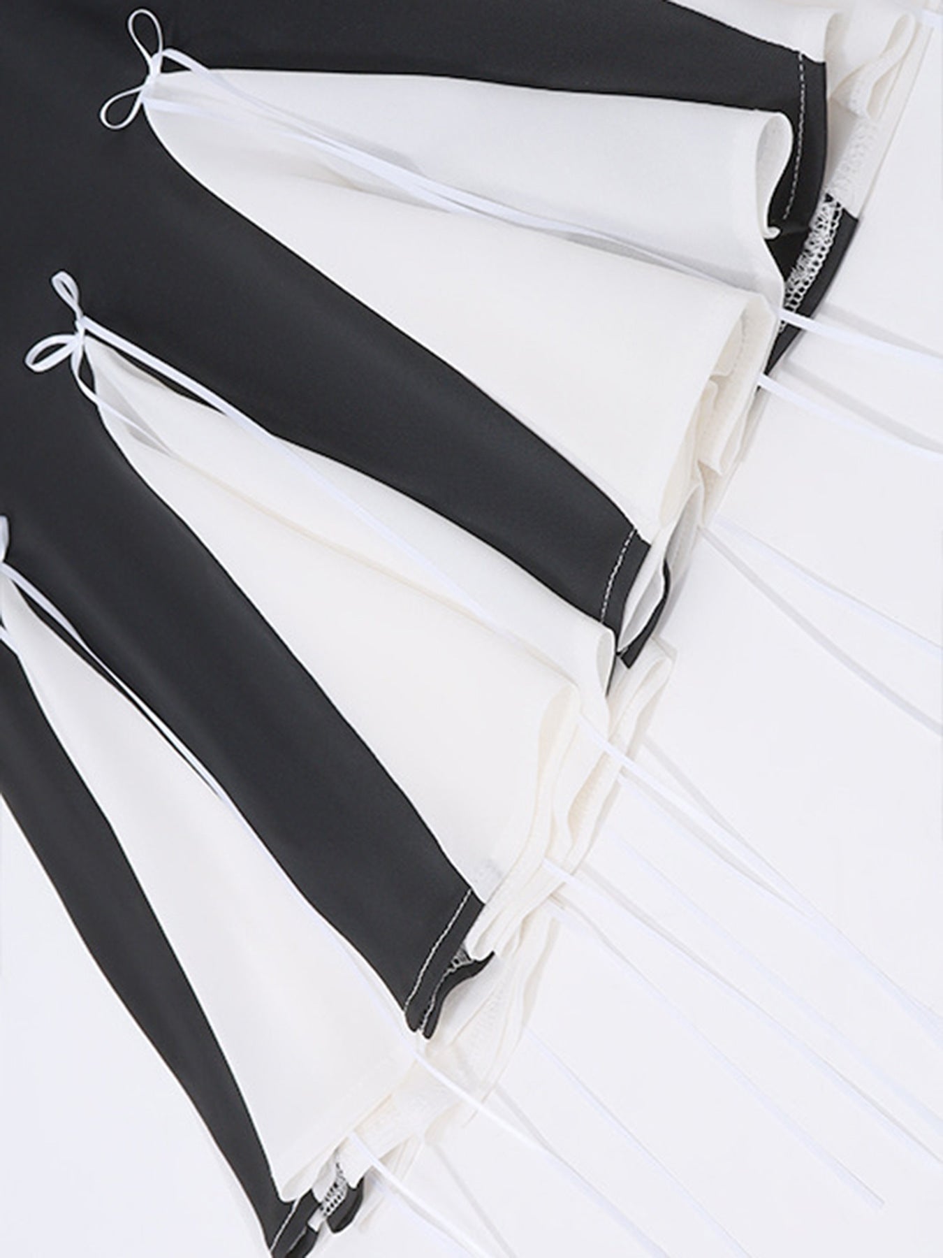 Black and white mini dress with bowknot details and tie accents.