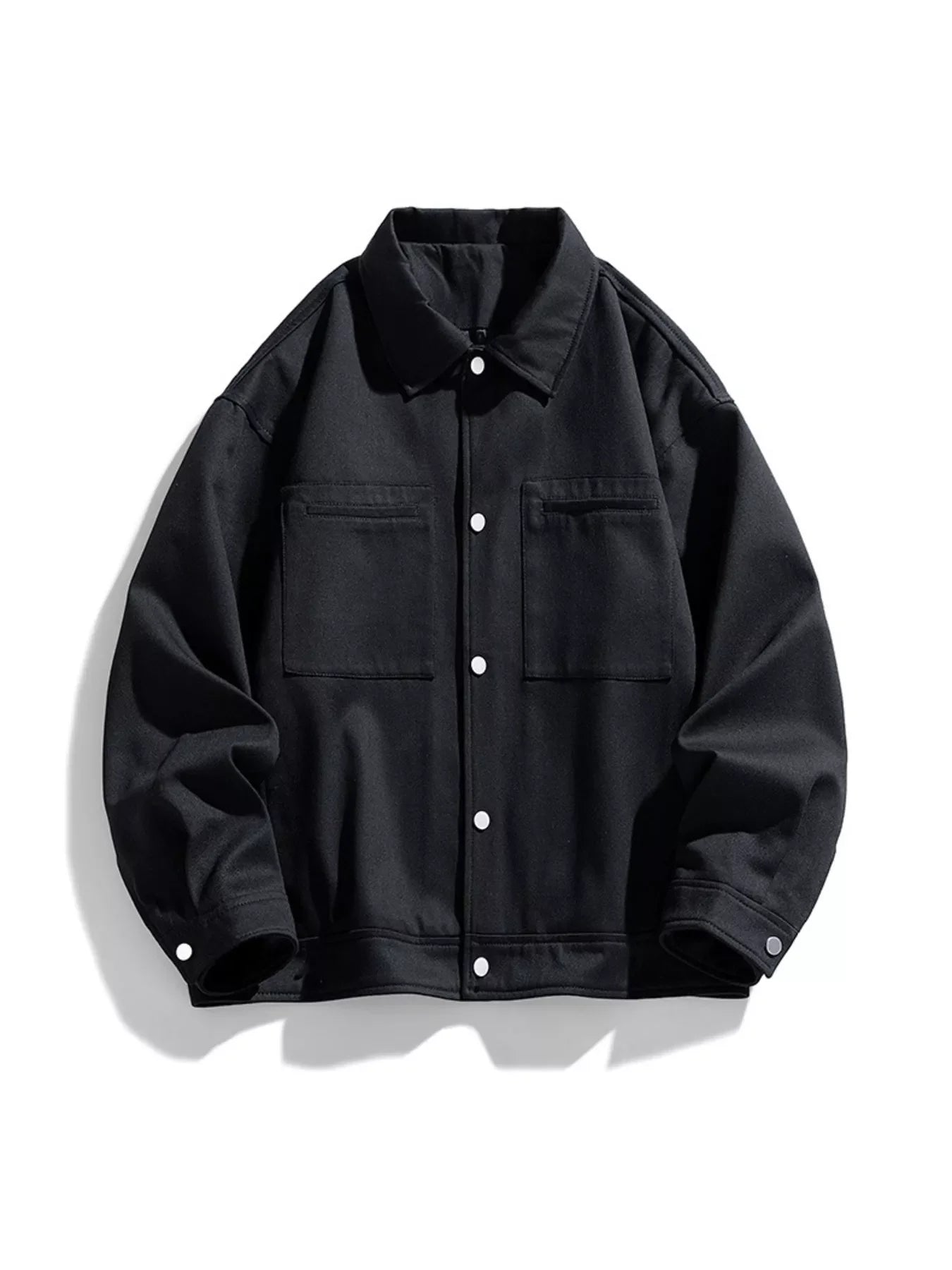 Black oversized casual snap jacket with two chest pockets and button closure
