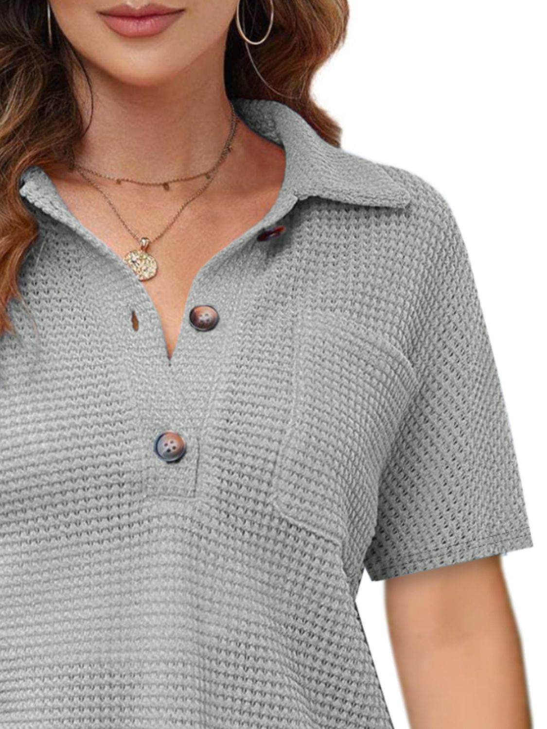 Gray waffle knit polo shirt with button detail and short sleeves
