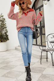 Chevron knit polo sweater in rust and white with button detail.