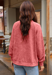 Washed cotton utility jacket in burnt coral with crew neck and long sleeves.