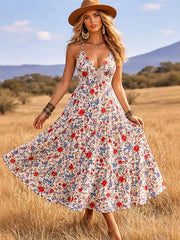 White floral midi dress with V-neck and spaghetti straps, tiered skirt