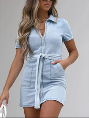 Light blue denim shirtdress with short sleeves, zip front, and tie belt.