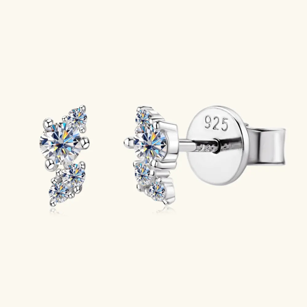 Silver stud earrings with a cluster of clear round cubic zirconia stones.