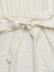 Beige maxi dress with tie waist and textured fabric detail