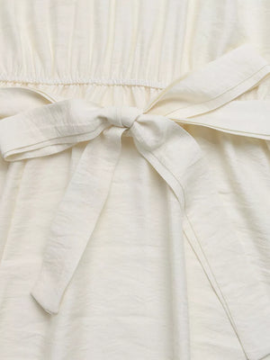 Beige maxi dress with tie waist and textured fabric detail