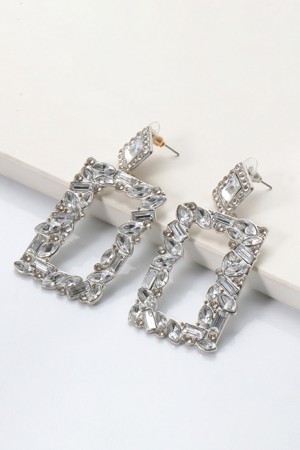 Geometric jewel box earrings with clear crystals and silver alloy setting.