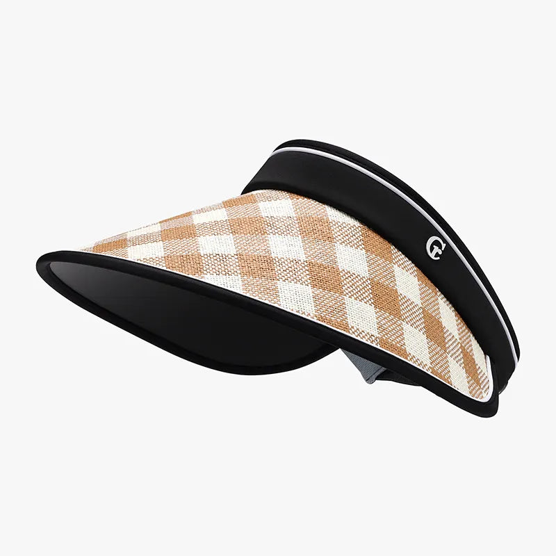 Gingham visor in caramel and ivory with adjustable strap and black brim.