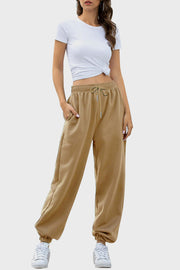 Tan relaxed-fit cuffed sweatpants with drawstring waist and pockets.
