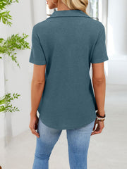 Peacock blue waffle knit button placket t-shirt with collared neckline and short sleeves.